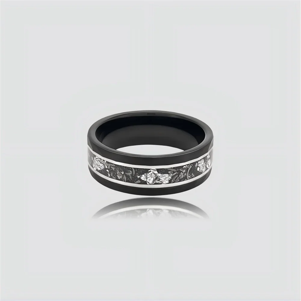 The Stellar Rift Precision-engineered ring featuring silver foil inlay and hammered Black Aerospace-grade Tungsten.
