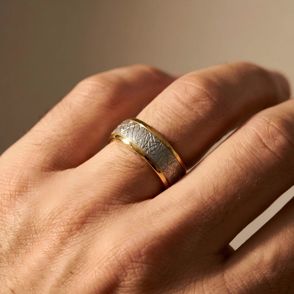 Men's two-tone ring with brushed silver center and polished gold edges on hand