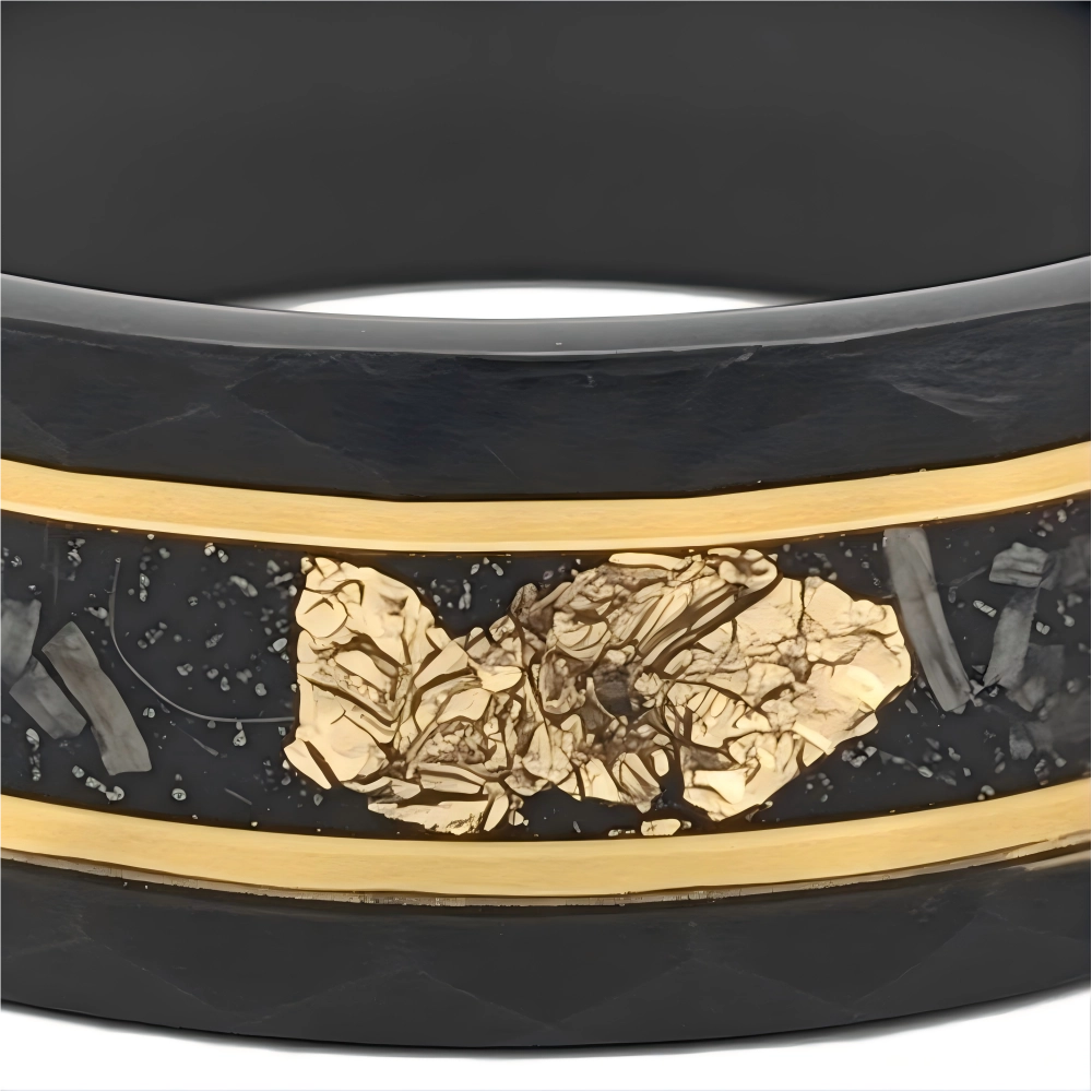 Macro detail of faceted hammered texture and organic crystalline fragmentation on The Void Fragment showcasing Authentic Muonionalusta Meteorite and 18K Gold PVD coating.
