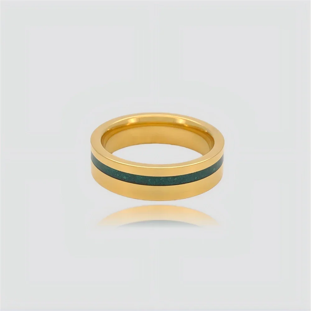 The Verdant Monolith Precision-engineered ring featuring a natural malachite inlay and 18K Gold PVD coated Aerospace-grade Tungsten.