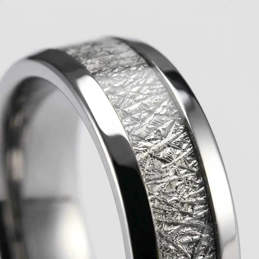 Macro detail of Widmanstätten pattern on The Astral Pathway showcasing Authentic Muonionalusta Meteorite and polished Aerospace-grade Tungsten.