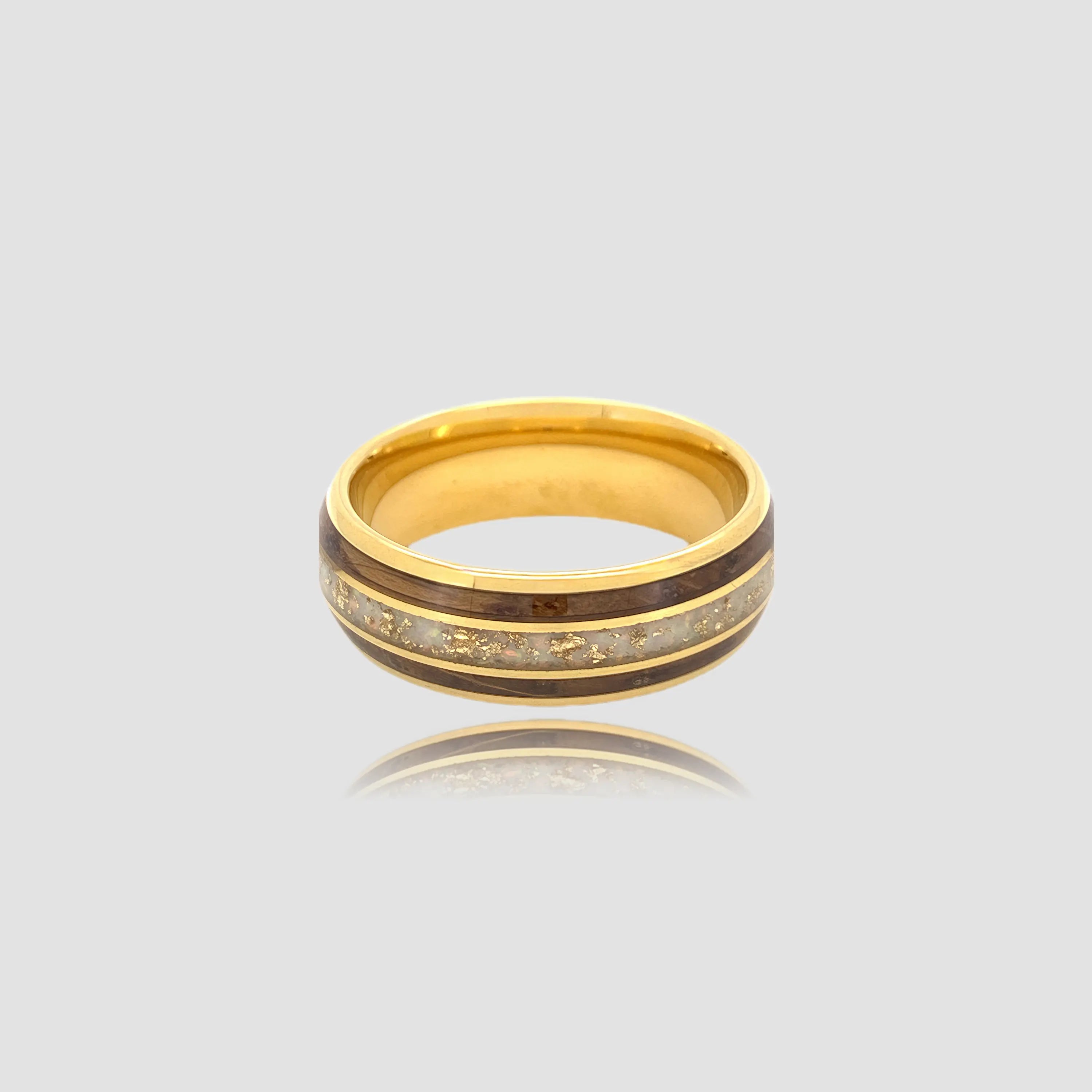 The Chronos Vessel Precision-engineered ring featuring crushed opal inlay and 18K Gold PVD coated Aerospace-grade Tungsten with whiskey barrel wood.