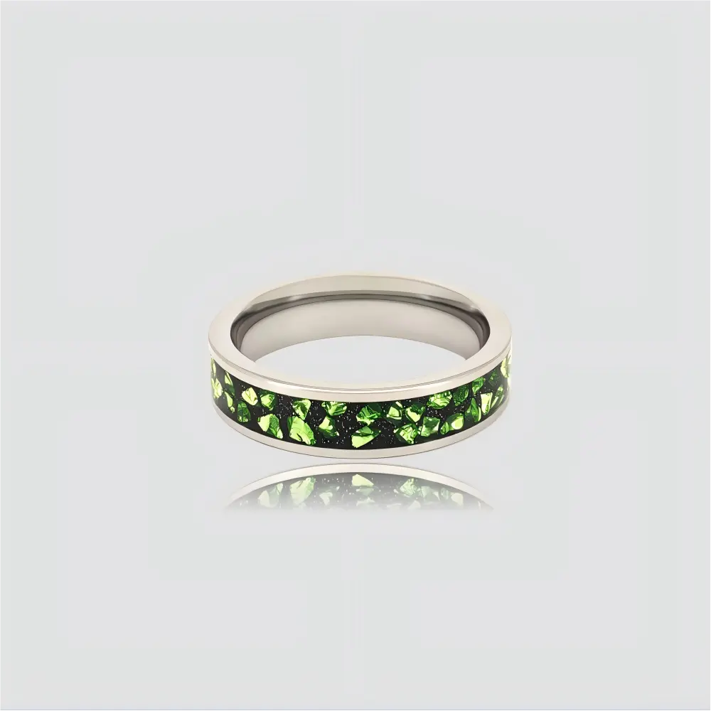 The Verdant Pulse Precision-engineered ring featuring crushed green crystal inlay and polished Aerospace-grade Tungsten.