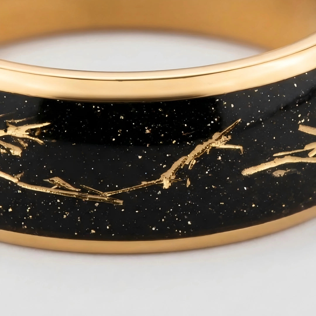 Macro detail of intricate embedded gold filaments and polished edges on The Aureate Thread showcasing 18K Gold PVD coating and Biological Resin.
