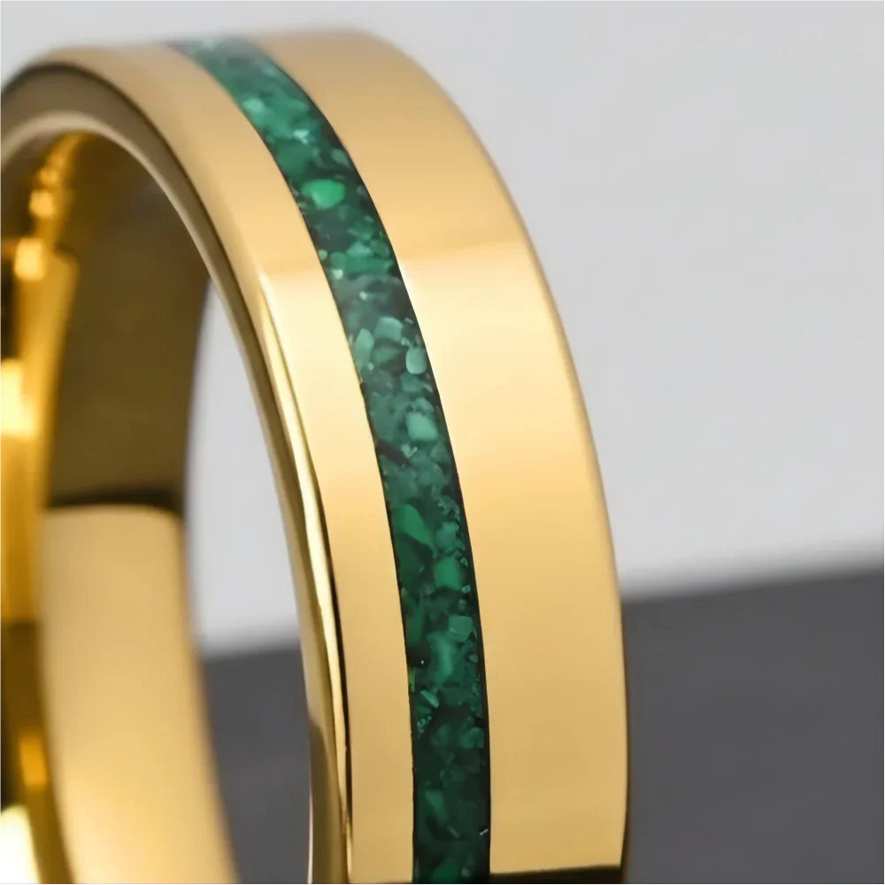 Macro detail of vibrant crushed mineral texture on The Verdant Monolith showcasing natural green malachite and polished 18K Gold PVD coating.