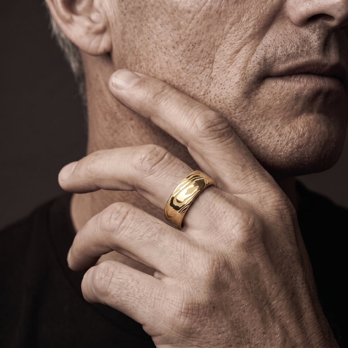The_Altar_Strata_Domed_Forged_Damascus_18K_Gold_PVD_Structural_Band-close-up-worn-on-hand