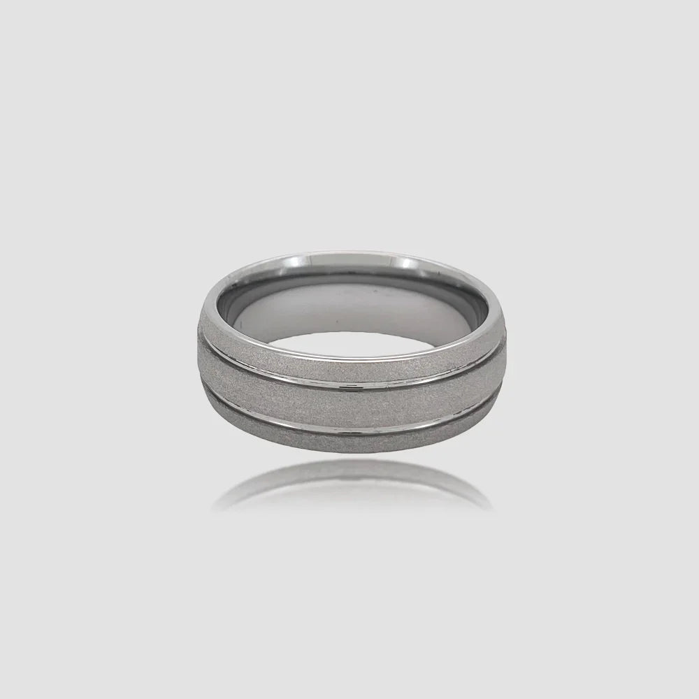 The Argent Monolith Precision-engineered ring featuring a textured sandblasted surface and polished parallel grooves on silver-tone Aerospace-grade Tungsten.