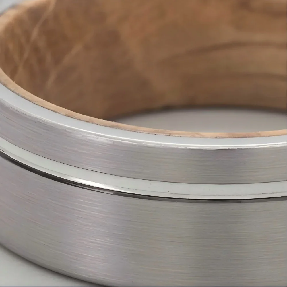 Macro detail of a precision-milled center line, satin brushed finish, and interior grain pattern on The Heritage Cask showcasing Aerospace-grade Tungsten and natural whiskey barrel wood.