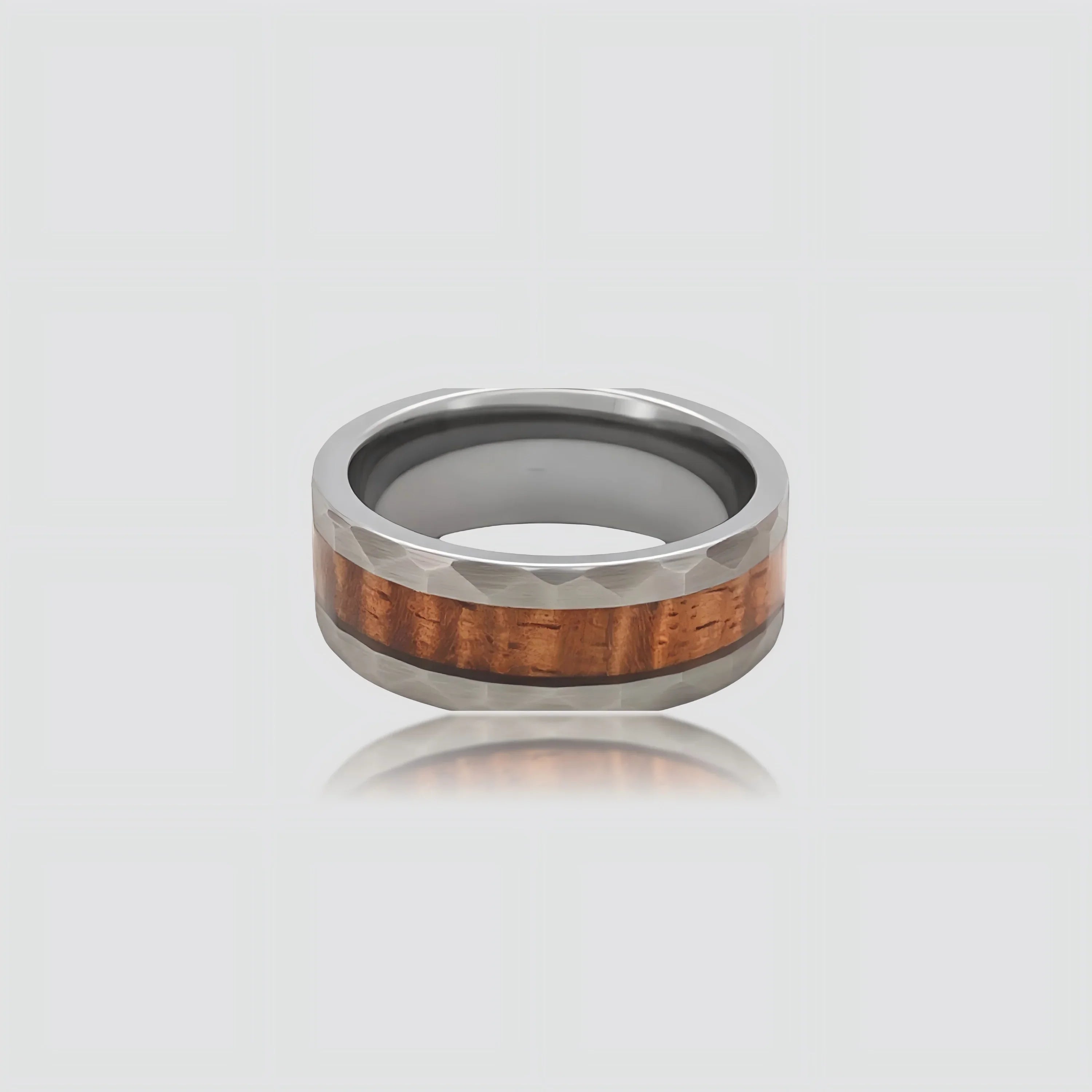 The Heritage Cask Precision-engineered ring featuring whiskey barrel wood inlay and faceted Aerospace-grade Tungsten.