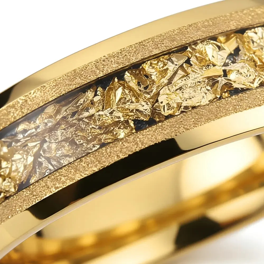 Macro detail of sandblasted finish on The Gilded Grain showcasing 18K Gold PVD coating and gold foil.