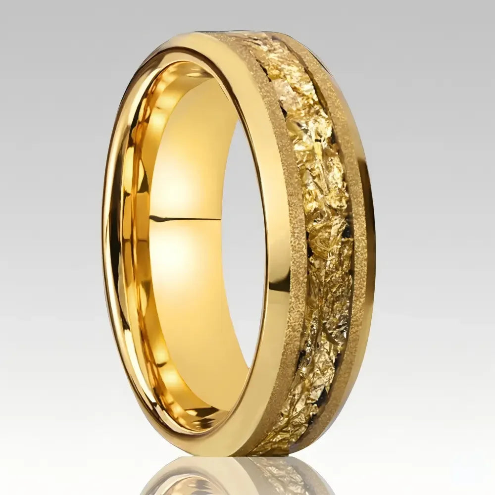 Men's gold tungsten ring with textured meteorite inlay on a grey gradient background