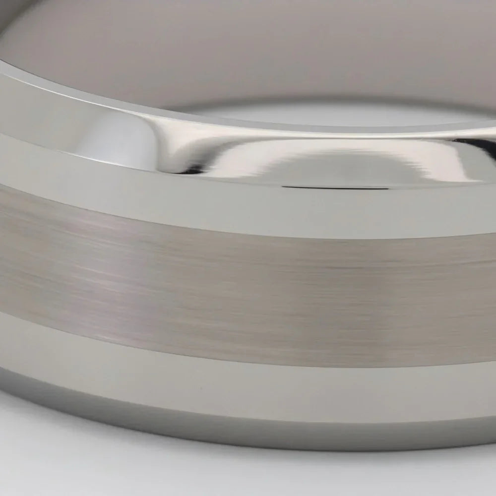 Macro detail of precision-milled beveled edges and fine brushed finish on The Obelisk showcasing Aerospace-grade Tungsten.