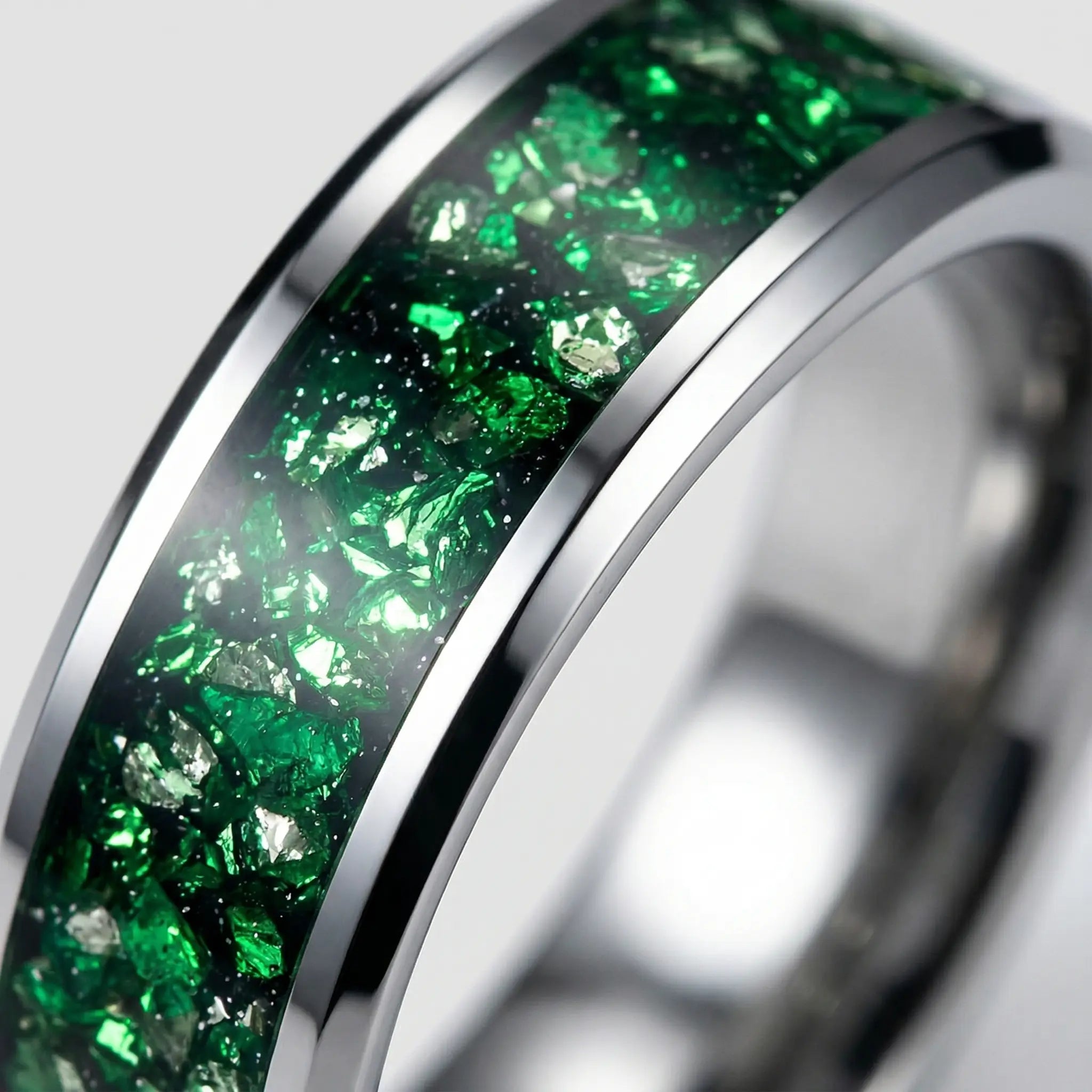 Macro detail of vibrant crushed mineral texture on The Verdant Pulse showcasing crushed green crystal and polished Aerospace-grade Tungsten.